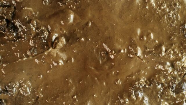 Super Slow Motion Shot of Splashing Mud Background at 1000fps.