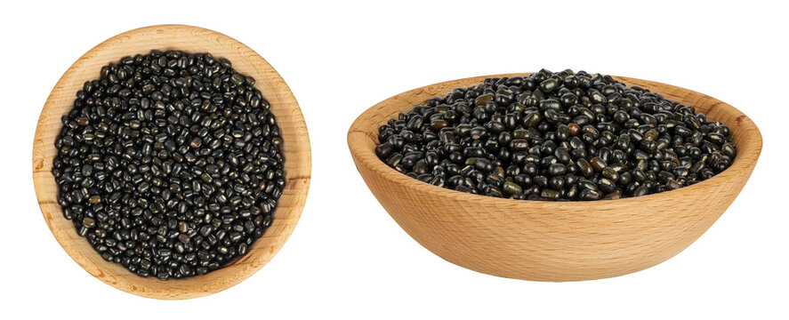 Black bean or Urad dal, black gram, vigna mungo in wooden bowl isolated on the white background. Top view. Flat lay.
