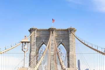 The pedestrian section of the Brooklyn Bridge in New York City is empty of people during the day.
