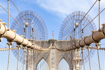 The pedestrian section of the Brooklyn Bridge in New York City is empty of people during the day.