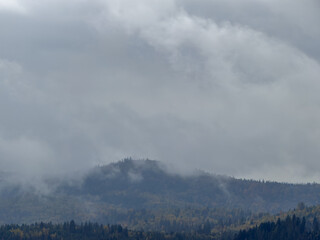 Misty Autumn Rain Clouds over Ukrainian Carpathian Mountains.