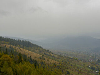 Misty Autumn Rain Clouds over Ukrainian Carpathian Mountains.