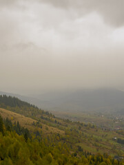 Misty Autumn Rain Clouds over Ukrainian Carpathian Mountains.
