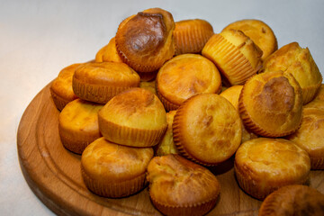 Pile of golden cornbread muffins closeup