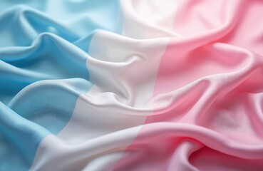 Transgender pride flag in soft fabric folds. Gentle waves of blue white and pink satin material create a smooth backdrop for LGBTQ identity and awareness. Symbol of equality and pride.