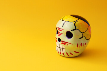 Catrina, ceramic skull decorated with flowers and vibrant colors