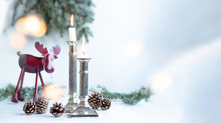 Cozy Christmas Scene with Candles, Pinecones and Toy Reindeer