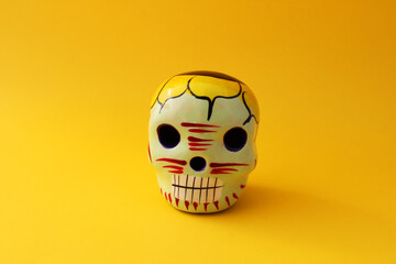 Ceramic skull decorated with flowers and vibrant colors, Catrina