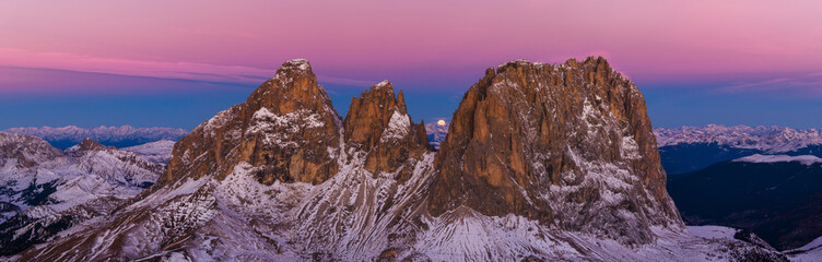 Panoramic view of Dolomite mountain peaks in beautiful morning light. Early winter scene with...