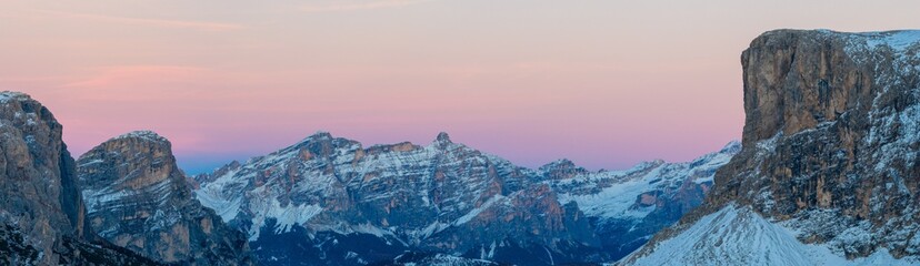 Panoramic view of Dolomite mountain peaks in beautiful morning light. Early winter scene with...