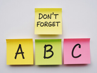 Colorful sticky notes remind you to learn the ABCs and remember important tasks, perfect back to school, education, or memory enhancement promotions