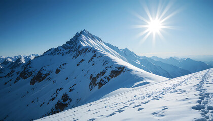 Majestic snow covered mountain peak bathed in bright sunlight under a clear blue sky