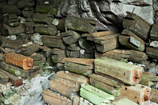 Inside the Lumiang Burial Cave, filled with many old coffins, Sagada, Luzon, Philippines