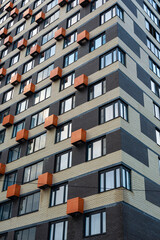 A repeating endless facade of a multi-storey residential modern building in Europe. High quality...