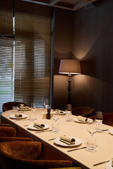 intimate table with ambient lighting, elegant private space illuminated softly for gatherings