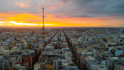 Bari at dusk with a panoramic view of the historic center, bustling port, and calm Adriatic Sea...