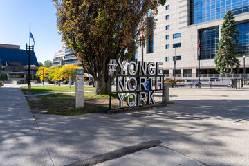 Naklejka premium Toronto, Canada - September 28, 2025: # YONGE NORTH YORK ground sign at Lastman Square in Toronto, Canada. North York is a former city and is now one of the six administrative districts of Toronto. 