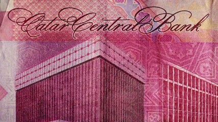 Detailed Macro View of a Qatari Riyal Banknote, Revealing Intricate Engravings of the Central Bank Building, Arabian Horses, a Camel, and Oryx, Symbolizing Finance - Powered by Adobe