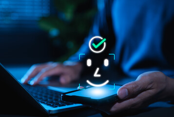 Facial recognition and Face ID biometric authentication concept. User holding smartphone, face scan icon, and check mark, representing cybersecurity, digital identity and secure mobile access.