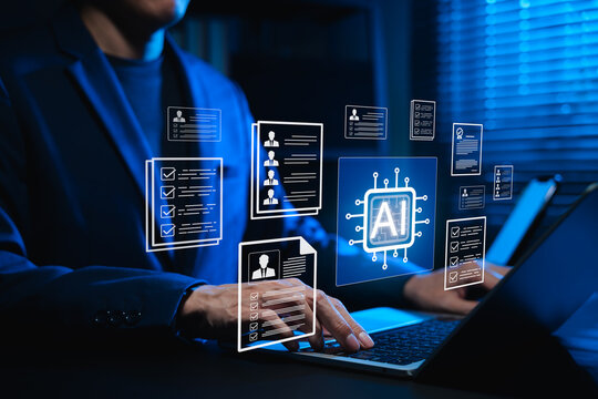 Businessman using AI-powered software on laptop for automated resume screening and candidate selection. Concept of artificial intelligence in HR tech, AI recruitment analytics and digital hiring.