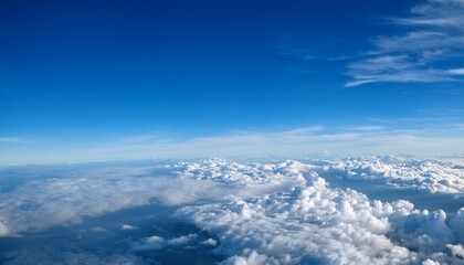 Fototapeta premium Perfect High Definition Airplane Window View With Bright Blue Sky And Scattered Clouds Above The Horizon