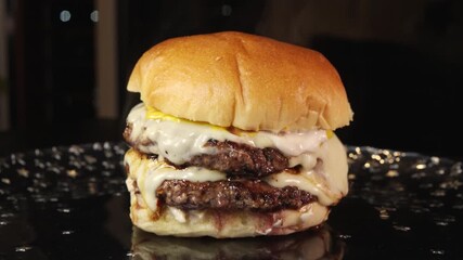 Steaming double deck burger with rare beef patties, melted cheese, homemade mayo, and mustard. Juicy, indulgent, and perfectly cooked in video. - Powered by Adobe