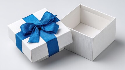 White open gift box with a blue ribbon tied on top, empty and prepared for a surprise, isolated on white backgrounded