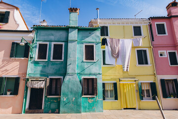 Burano island colorful houses with hanging laundry