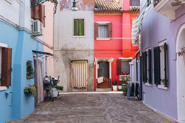Colorful homes lining a picturesque alley in Burano