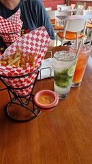 Cocktails and French Fries on Table