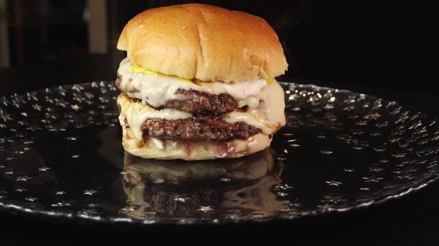 Steaming double deck burger with rare beef patties, melted cheese, homemade mayo, and mustard. Juicy, indulgent, and perfectly cooked in video.