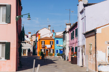 Colorful houses lining Burano island street, Venice