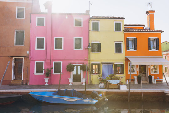 Burano island colorful houses lining a Venice canal - Powered by Adobe