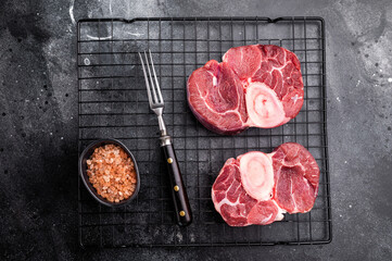 Fresh raw ossobuco Premium veal shank, ideal for slow cooking and creating hearty, comforting meals that impress. black background. top view