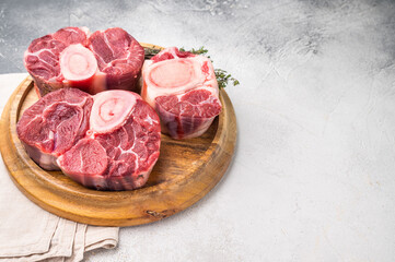 Beautifully marbled raw veal ossobuco, perfect cross cut shank meat for traditional Italian recipes and savory family dinners. white background. top view