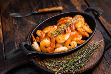 Deliciously seasoned grilled shrimp prawns with vibrant colors, a must-have for seafood lovers and culinary enthusiasts. wooden background. top view