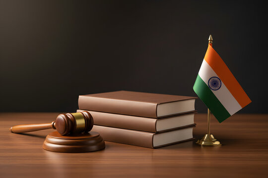 indian flag with judge&rsquo;s gavel and law books symbolizing justice in india