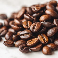 Naklejka premium Close up of roasted arabica coffee beans piled on a white surface for a rich coffee experience