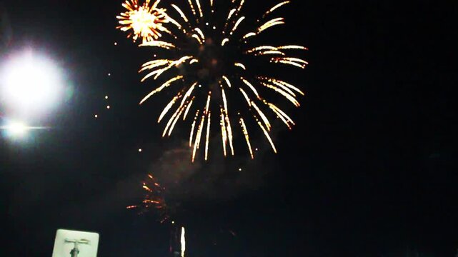 Fireworks on a thea background. Red and yellow fireworks rosettes