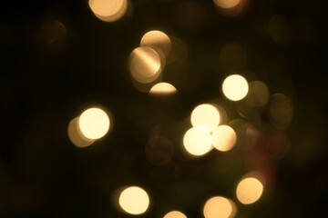 Warm gold spots of light on dark background