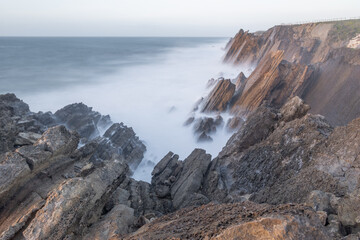 Sao pedro de moel rocky coastline with flowing ocean water