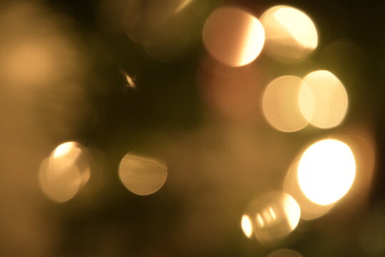 Warm gold spots of light on dark background