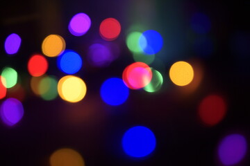 Colorful light spots on black background