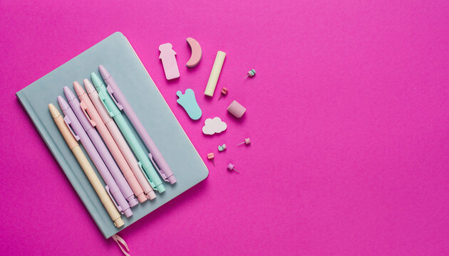 Pastel pens and cute office supplies on a notebook create a vibrant and inspiring workspace for creative projects and organized planning sessions