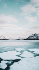 A beautiful serene winter landscape showcasing ice formations and majestic mountains