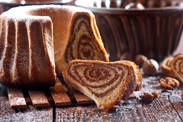 Potica - traditional Slovenian bread cake. Sweet bread roll stuffed with walnuts and sprinkle with sugar