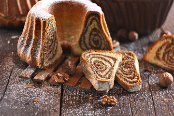 Potica - traditional Slovenian bread cake. Sweet bread roll stuffed with walnuts and sprinkle with sugar