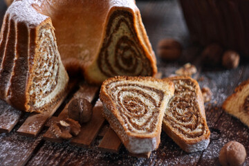 Potica - traditional Slovenian bread cake. Sweet bread roll stuffed with walnuts and sprinkle with sugar