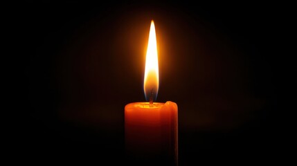 Fototapeta premium A single candle burns brightly in the dark, casting a warm glow around it. The flame dances gently, creating a soothing atmosphere perfect for relaxation or meditation.