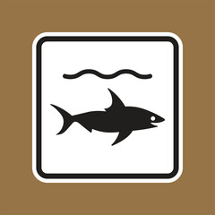 Iconic shark symbol on a brown background for marine safety signage use